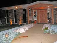 Frost covering the juniper bushes at front of inn.