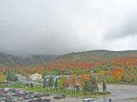 Maple trees band Killington in red glow.