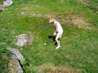 Hacking and slashing...  Mary tackles a tight lie in the junk approaching the 18th green on Green Mountain National.
