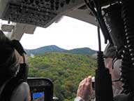 Pico Peak thru the windshield of a helicopter just after lift-off from Green Mountain National Golf Course