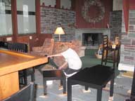 Mary refinishing tables in the Great Room