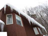 Ice dams ready to release from the back building at the Birch Ridge Inn, Killington.