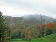 Fog rising from behind the 18th hole on the Green Mountain National Golf Course