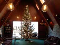 Work progressing on decorating the Birch Ridge Inn Christmas Tree