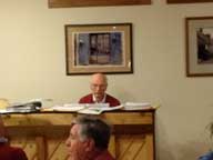 Dr Lyons coaxing the ivory keys for some Christmas Carols.