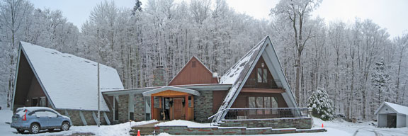 Birch Ridge Inn draped in early morning snow.