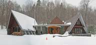 Early morning snow covers the Birch Ridge Inn at Killington