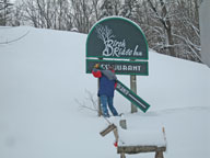 Ceremonial removal of the Vacancy sign at the Birch Ridge Inn