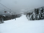 Light snow falling on Skyburst at Killington.