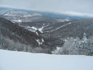 Looking down to the Roaring Brook Umbrella Bars at the K1 Base Lodge from the top of East Falls