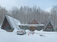 Light snow falling around the Birch Ridge Inn at Killington.