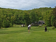 The Bagel striking an approach shot on the 9th hole on Green Mountain National