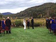 Kelly and Tucker exchanging vows at the Sherburne Memorial Library.