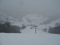 Heavy snow falling on Killington Resort as seen from lower Superstar headwall.