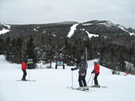 Chuckles, Ruts, and the beautiful Miss Jane ponder our next move at the top of Bear Mountain.