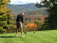 The Bagel tees off on the 16th hole at Green Mountain National surrounded by fall foliage glory.