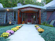 Fall Mums in bloom on the walkway leading to the inn.