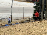 Mary and assistant Nicole cleaning front gardens