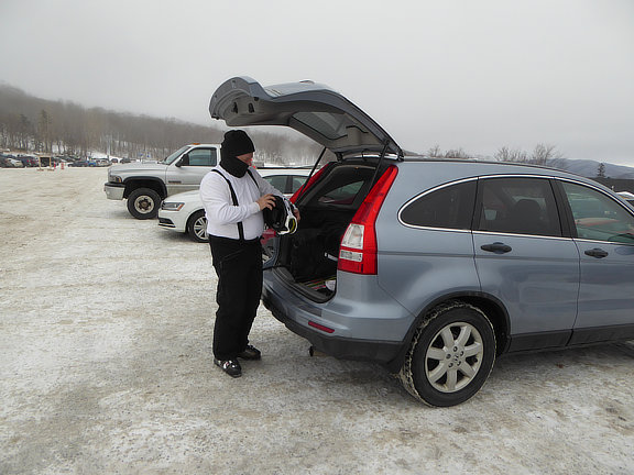 An artifact of Boots on in the house .... Making helmet adjustments in the K1 parking lot before beginning our ski day.