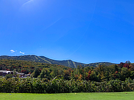 Color starting to show around Killington PeaK. From the 18th tee at the Killington Golf Course