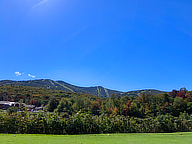Color starting to show around Killington PeaK. From the 18th tee at the Killington Golf Course